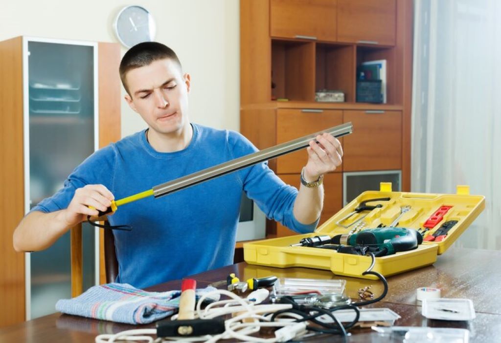Man assembling HVAC business tools